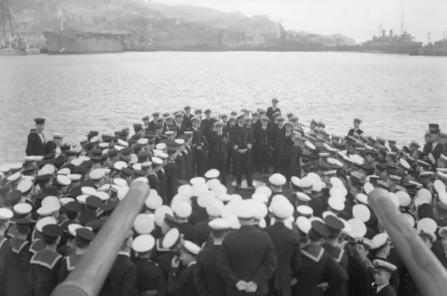 Vice Admiral Sir James Somerville, commander of Force H, addresses the crew of the cruiser HMS Hermione in Gibraltar on Christmas Day, 25 December 1941.

Visible in the background, alongside the old Shearlegs (Las Tres Patas), is the aircraft carrier HMS Argus, the last surviving aircraft carrier of Force H.

Just over a month earlier, on 13 November 1941, HMS Ark Royal, the flagship carrier of Force H and instrumental in the hunt for the German battleship Bismarck earlier that year, was torpedoed by the German submarine U 81 while returning to Gibraltar after delivering fighter aircraft to Malta. She sank the following day.

In early 1942, HMS Eagle replaced Ark Royal in Force H. During Operation Pedestal on 11 August 1942, she too was torpedoed and sunk while escorting a vital convoy bound for the besieged island of Malta.

#gibraltar #wwii #ww2 #heritage #history

📸 Kenneth Busuttil