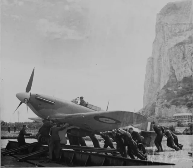 An RAF Hawker Hurricane being pushed onto a flat barge in Gibraltar in 1942. The fighter was possibly being transported for use as a temporary deterrent against German bombers attacking convoys in the Atlantic, beyond the range of normal fighter cover.

The Hurricane would be placed on a ramp aboard a Catapult Armed Merchant ship and launched into the air using booster rockets. With no way of landing back aboard the ship, the aircraft would have to ditch in the sea, with the pilot then picked up by an escorting destroyer.

#history #wwii #ww2 #gibraltar #heritage

📸 Kenneth Busuttil