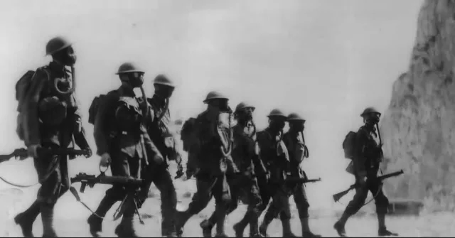 Royal Marines donning their gas masks as they return from the firing range at North Front in March 1938.

At first glance, the scene could almost be mistaken for the Western Front during the First World War.

The Marines are still wearing old First World War-era uniform and webbing. A new pattern of webbing had been introduced by this time, but the transition was gradual, with priority given to British infantry regiments and some units continuing to use the older equipment for longer.

#gibraltar #wwii #ww2 #history #heritage

📸 Kenneth Busuttil